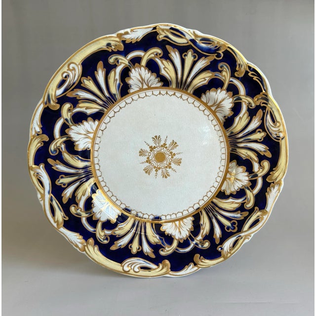 Set of 4 antique English Staffordshire porcelain dinner plates. Floral design, embossed edges and heavy gold trimmed....