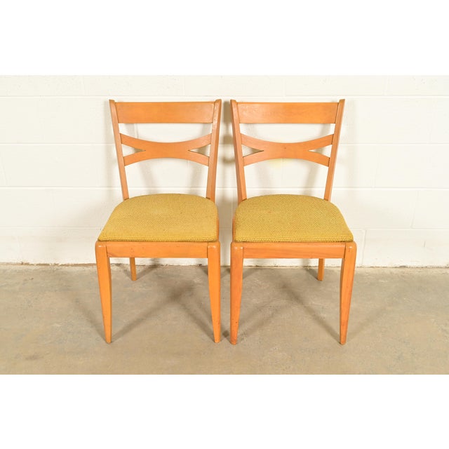 A gorgeous pair of Mid-Century Modern side chairs or dining chairs By Heywood Wakefield USA, 1950s Solid sculpted maple...