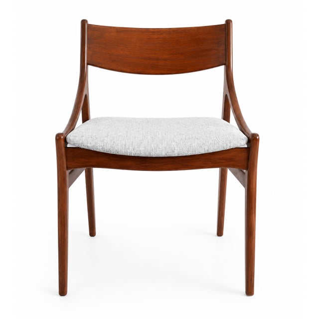 Scandinavian elegance and timeless lines define this set of four iconic chairs from 1960s Danish design, by H. Vestervig...