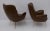 Pair of armchairs upholstered in faux leather and brass feet, 1950s Italian design. The armchairs have the original...