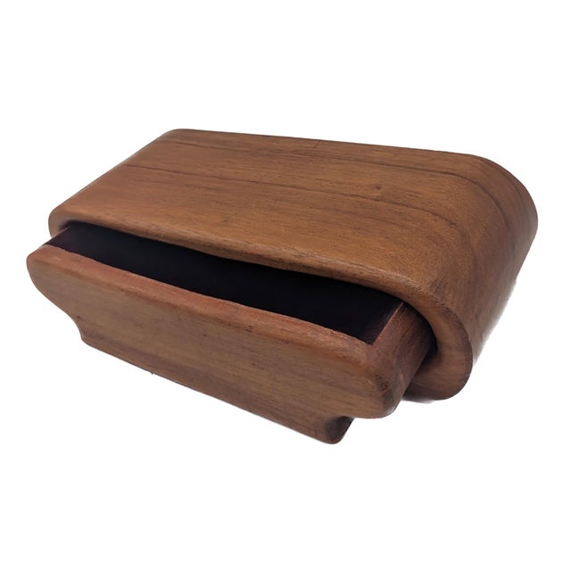 Offered is a mid 20th Century, circa. 1970s handcrafted Teak wood jewelry or trinket box that has a single felt-lined...