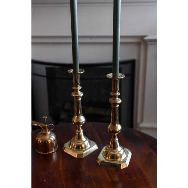 These are a pair of vintage neoclassical brass baluster candlesticks with a square base. Measure 12.5" high and over 4.5"...