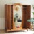 Three-door oak wardrobe with an oval bevelled mirror, stylistically situated between late Art Nouveau and reform-oriented...