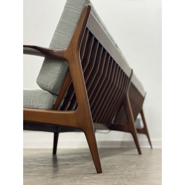 Elevate your living space with this stunning set of two Mid-Century Modern loveseats. Crafted with beautiful walnut or...