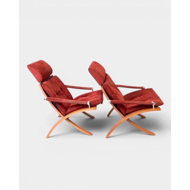 Danish set of two Laxy lounge chairs with their original matching footstools, manufactured by Skipper Furniture. The Laxy...
