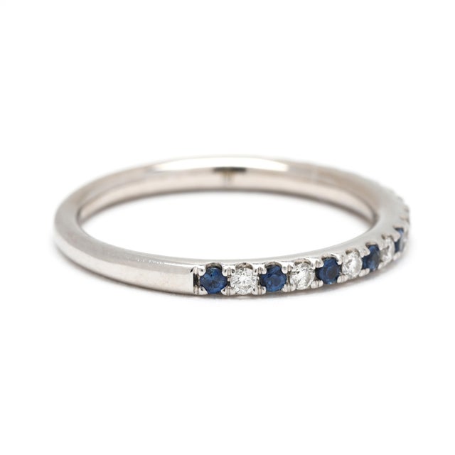 Stones: sapphire, 10 round 1.5 mm approximately .15 total carats diamond, 9 round brilliant cut 1.5 mm approximately .13...