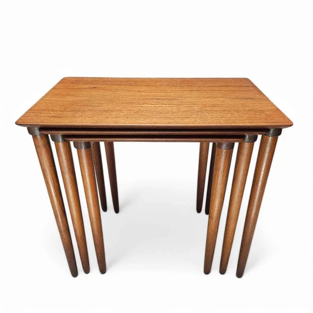 Elevate your living space with this exquisite COMPLETE set of Danish mid-century modern nesting tables designed by the...