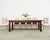 Gorgeous 20th century country French farmhouse dining table featuring a rare mahogany construction. The table has a 2 inch...