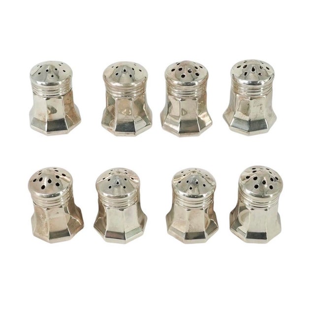 A vintage Cartier set of eight salt & pepper, octagonal form with a round domed lid. Each marked at the base “ Cartier...