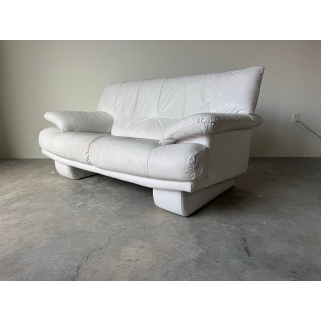 This authentic Natuzzi loveseat showcases classic Italian Postmodern design with clean architectural lines, generous...