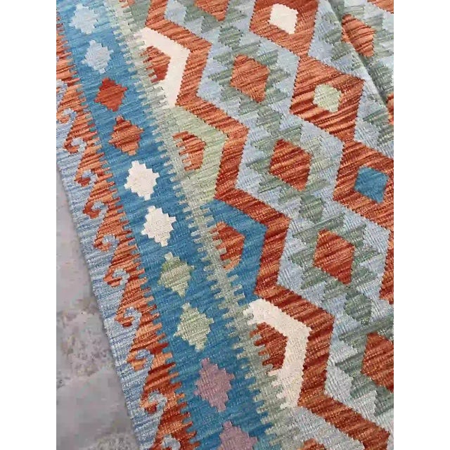 Hand-Woven Afghan Kilim Rug | Vibrant Geometric Design in Blue and Orange For Sale - Image 6 of 11