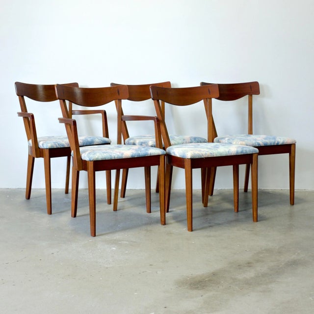 This set of five walnut dining chairs was designed by Merton Gershun for American of Martinsville's "Dania II" collection....