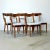 This set of five walnut dining chairs was designed by Merton Gershun for American of Martinsville's "Dania II" collection....