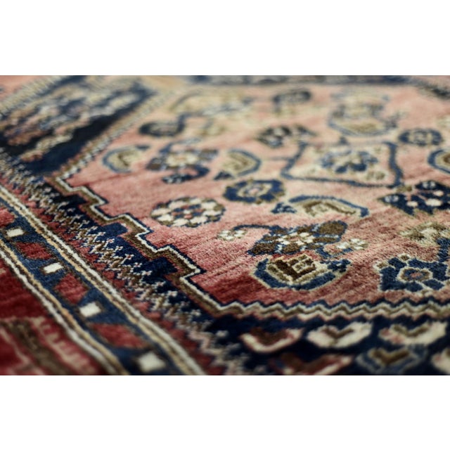 The authentic, antique rug with expressive, painterly colors and a pattern characteristic of the Orient. The hand-woven...