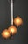 This Art Deco chandelier is chrome-plated and features three glass globes with Art Deco ornaments, offset in height. A...