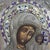 This antique Russian icon, dating to approximately 1900, depicts the revered Kazanskaya Mother of God. The central image...
