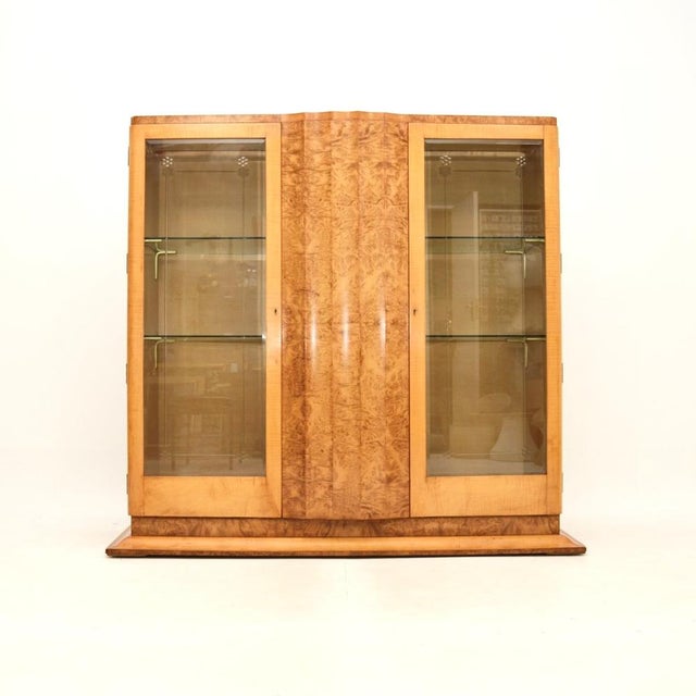 An outstanding Art Deco burr walnut and sycamore bookcase / cabinet by Epstein. This was made in England, it dates from...