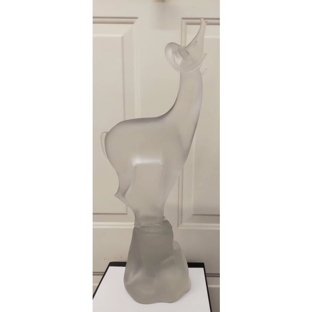 It is signed and in fabulous condition. We took different photos in different lighting. Measures 27 1/4" X 10" X 6".