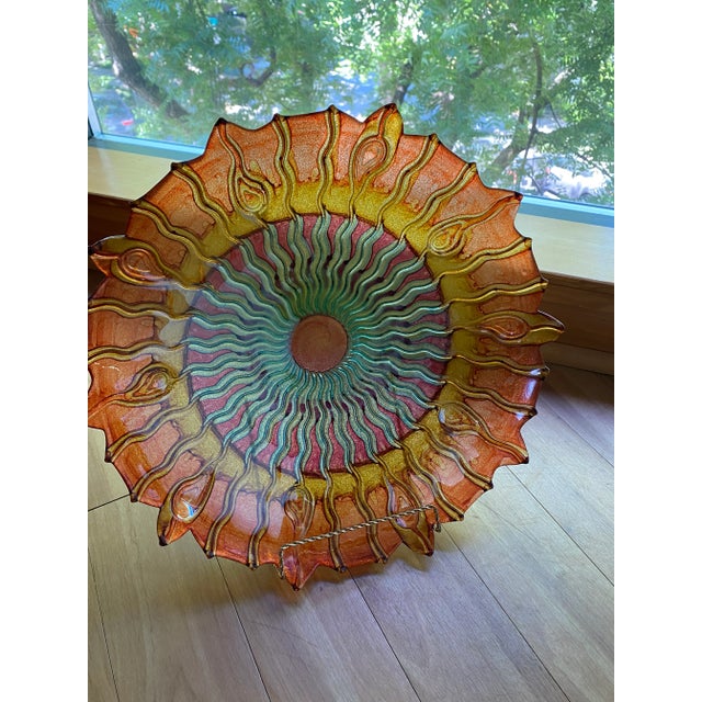 This exquisite Murano style glass dish features a beautiful peacock design in multi-color, reminiscent of a sunburst that...