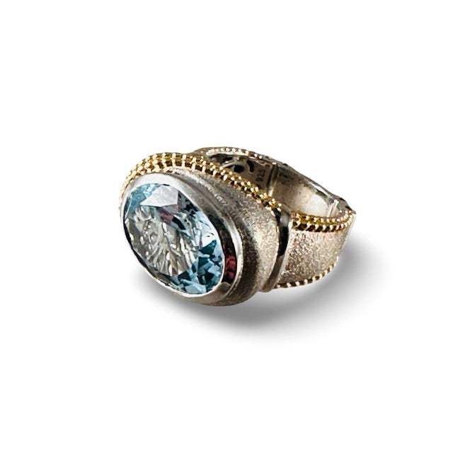 Oversized beautiful Blue Topaz gemstone ring, size 6. This ring is sterling silver with gold vermeil beaded edge detail....