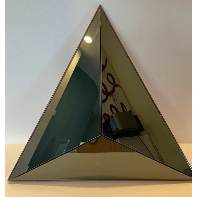 The volume mirror continues Robert Sukrachand fascination with Three-dimensional, reflective surfaces. Eschewing the...