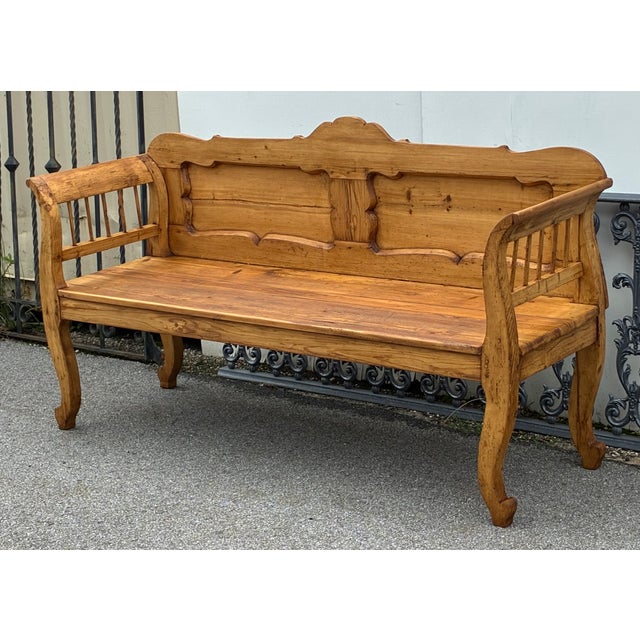 This lovely pine bench has everything. The top rail is beautifully scalloped with a crest in the center and straight lines...