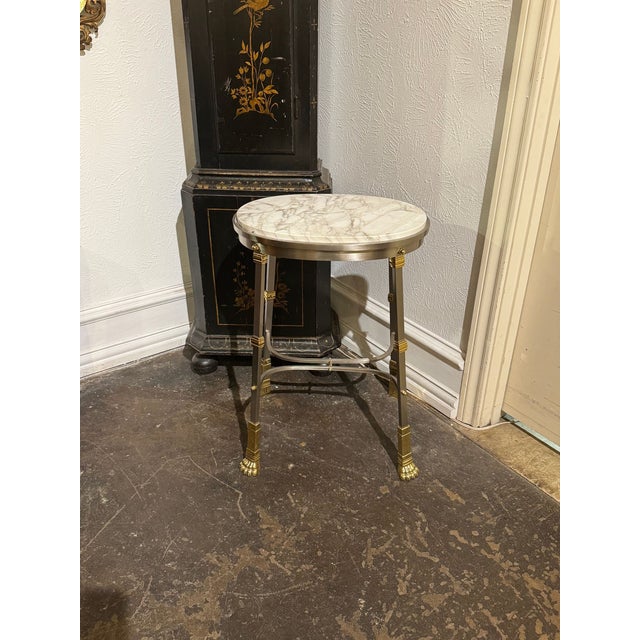 The Vintage French Maison Jansen Steel Side Table is a stylish and elegant piece of furniture that adds a touch of...