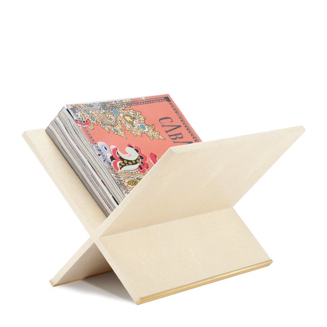 This stylish magazine rack in faux shagreen adds a pop of elegance that enhances a room, while also providing an...