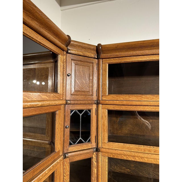 Beautiful antique oak Globe Wernicke corner bookcase. In perfect condition. Consisting of 24 stackable sections, including...