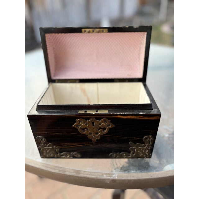 This is a stunning coramundel antique Georgian period box with scrolled brass trim. The box is in excellent condition;...