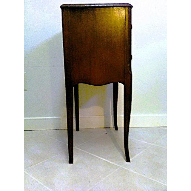 Mid century sewing table with two drawers in the arts and crafts / mission style with some ornate details and carvings....