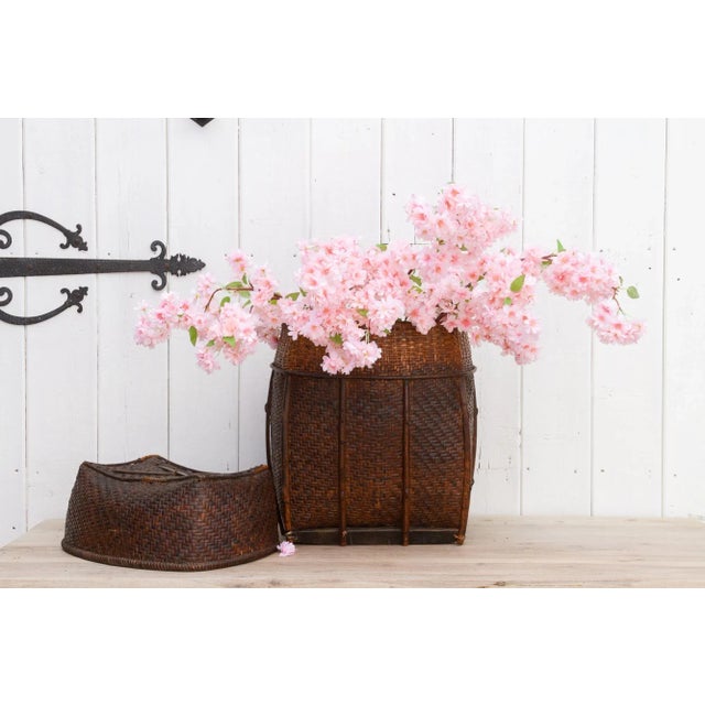 Beautiful handwoven made from bamboo and rattan. This large basket from Nepal features a double weave rounded body with a...