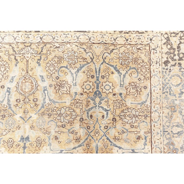 This antique Persian Tabriz rug, dating back to circa 1900, is a distinguished piece from Doris Leslie Blau, renowned for...