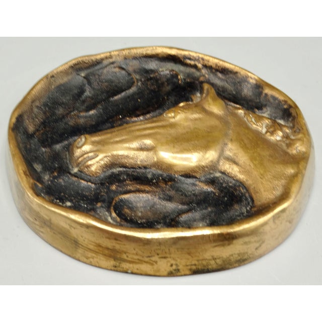 A beautiful French antique solid bronze vide poche or pocket empty dish handcrafted with lovely detail. It depicts a gilt...
