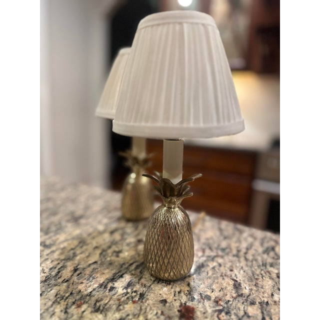 This vintage set of 2 miniature brass pineapple lamps is a unique desk, book shelf, or under counter feature. Used...