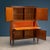A 1950s Italian-made drop-leaf cabinet with an important exotic wood veneer and precious Citronnier inlays and brass...