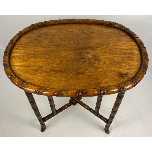 An antique hand carved folding teak wood table, 19th Century Chinese Tea Table that is stunning. Finest quality with...