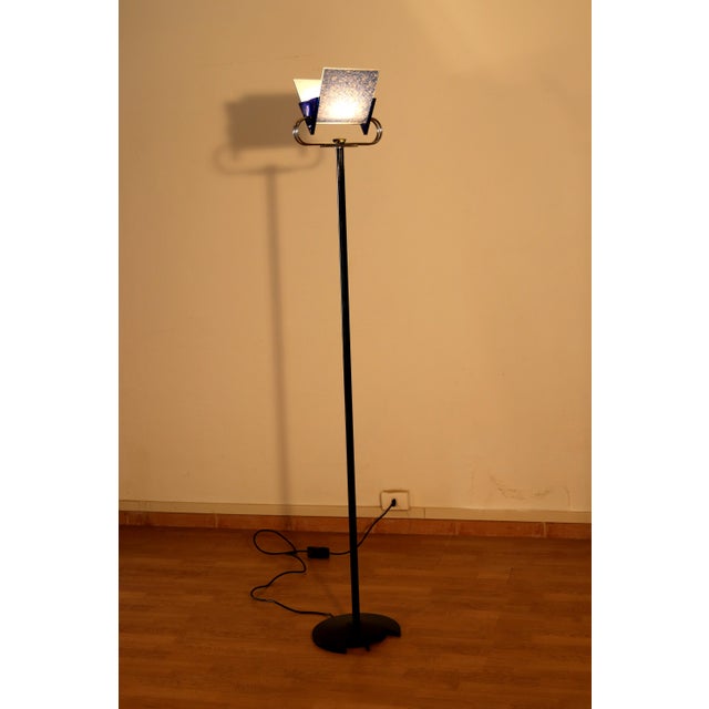 This refined "Triana" floor lamp is a quintessential icon of 1980s Italian postmodernism. Designed by award-winning duo...