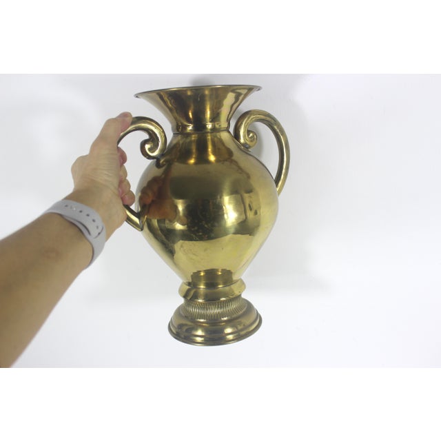 Large vintage brass vase with handles. This has patina, scratches, corrosion, rust, especially on the bottom and possible...