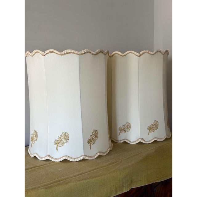 Vintage 1970s Hollywood Regency extra-large table lamps retailed by Sears, featuring opalescent glass fonts in the...