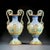 An exceptional pair of Italian hand-painted majolica vases dating to the late 19th century. The elegant baluster-shaped...
