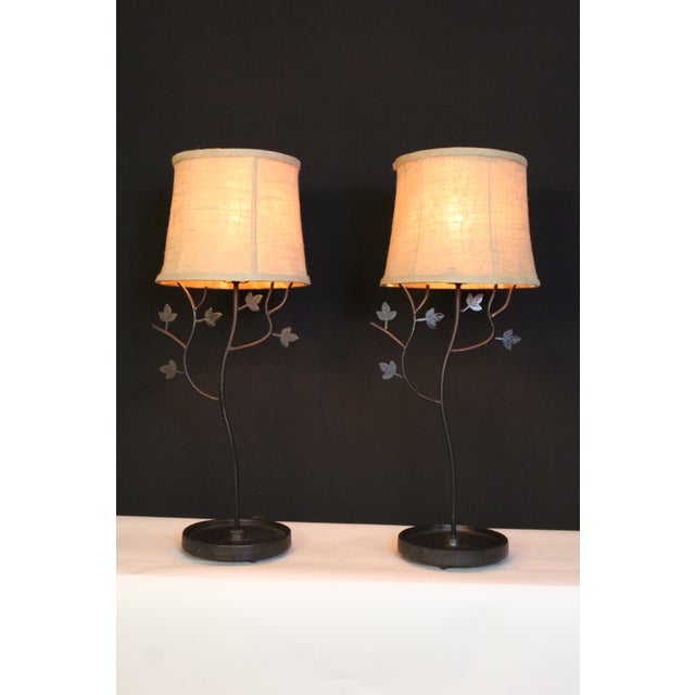 Charming pair of East Lake lamps. Graceful style. Cast iron base. Hand forged sculptured metal with bronze finish. Fitted...