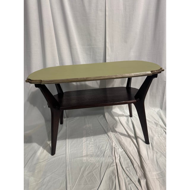 Cute Small 2 tier wooden coffee table. Sage green painted top and pewter trip.