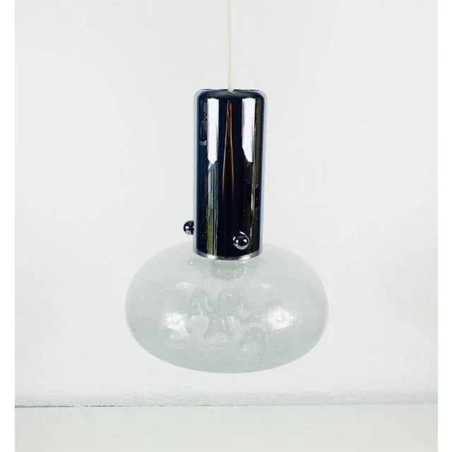 An pendant lamp made in Italy in the 1960s. It is fascinating with its Murano glass and the beautiful shape in it....