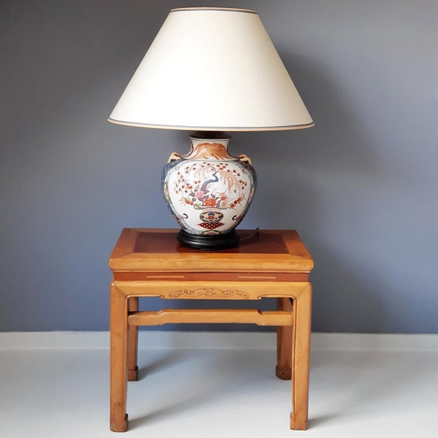 This Asian vase lamp (likely Japanese) is of considerable size with its shade. We assume it was produced in the 70s, but...