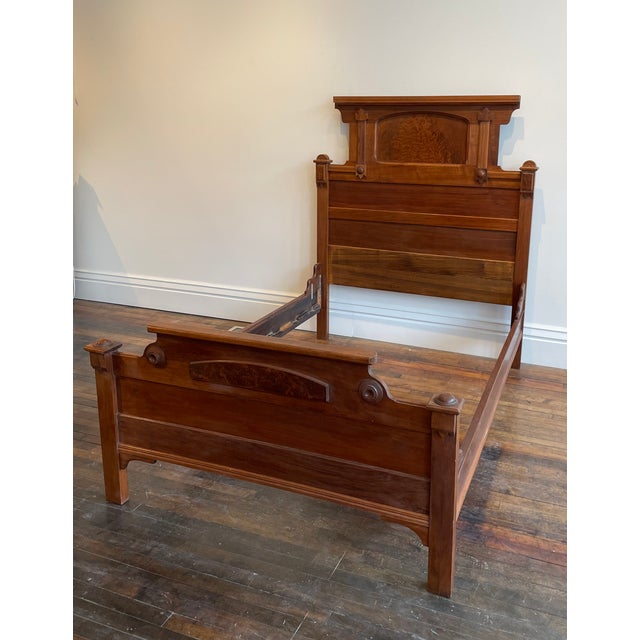 Antique Victorian/Eastlake Walnut Full Size Bed from the 1890s. Features stunning burl walnut inlay on the headboard and...