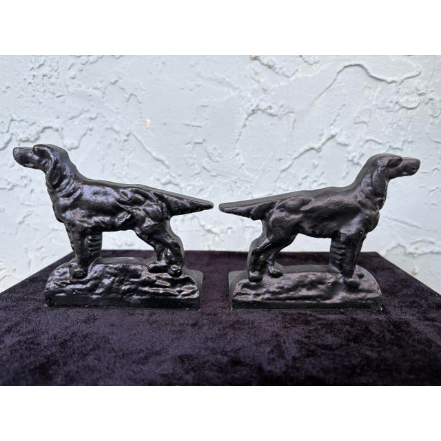 This vintage pair of bookends features stylized hunting dogs depicted in a classic alert stance. Crafted in cast iron, the...