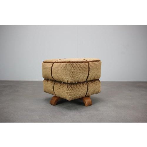 A distinctive 1930s art deco upholstered stool by jindřich halabala for up závody, originating from czechoslovakia. The...