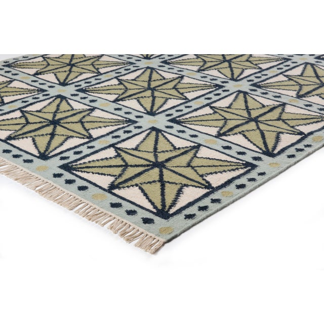 The serene beauty of the Star Rug was inspired by Moroccan tiles and antique American quilts. Symmetrical starbursts...
