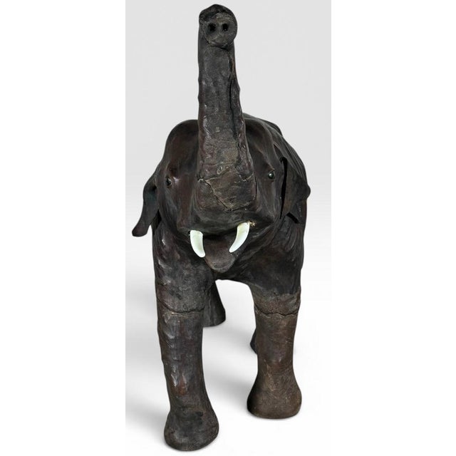 Vintage Mid-Century Leather-Wrapped Elephant Floor Sculpture This striking vintage mid-century leather-wrapped elephant...